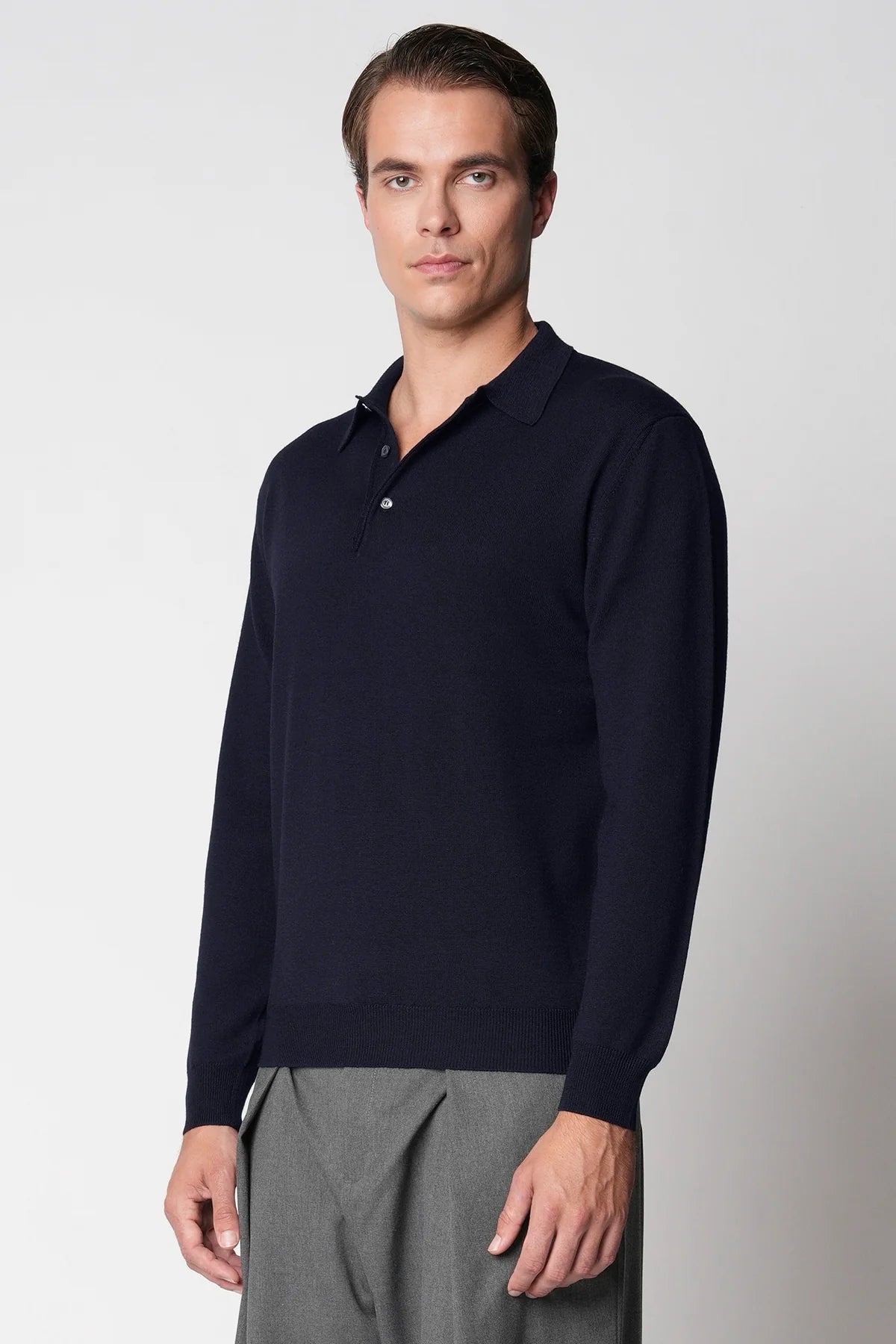 Polo bottoni rasato in lana merino extrafine